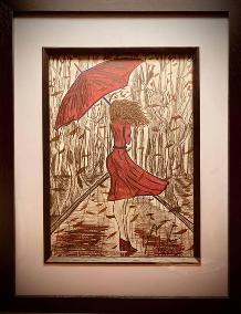 Framed watercolour and pencil artwork of lady in red dress and umbrella